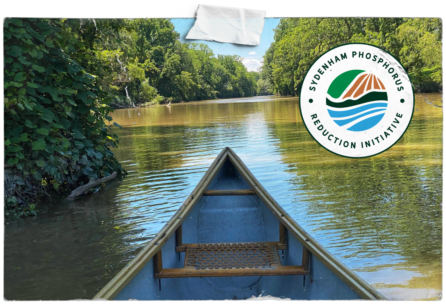 A picture of a canoe on a river with a logo that says phosphorus reduction initiative