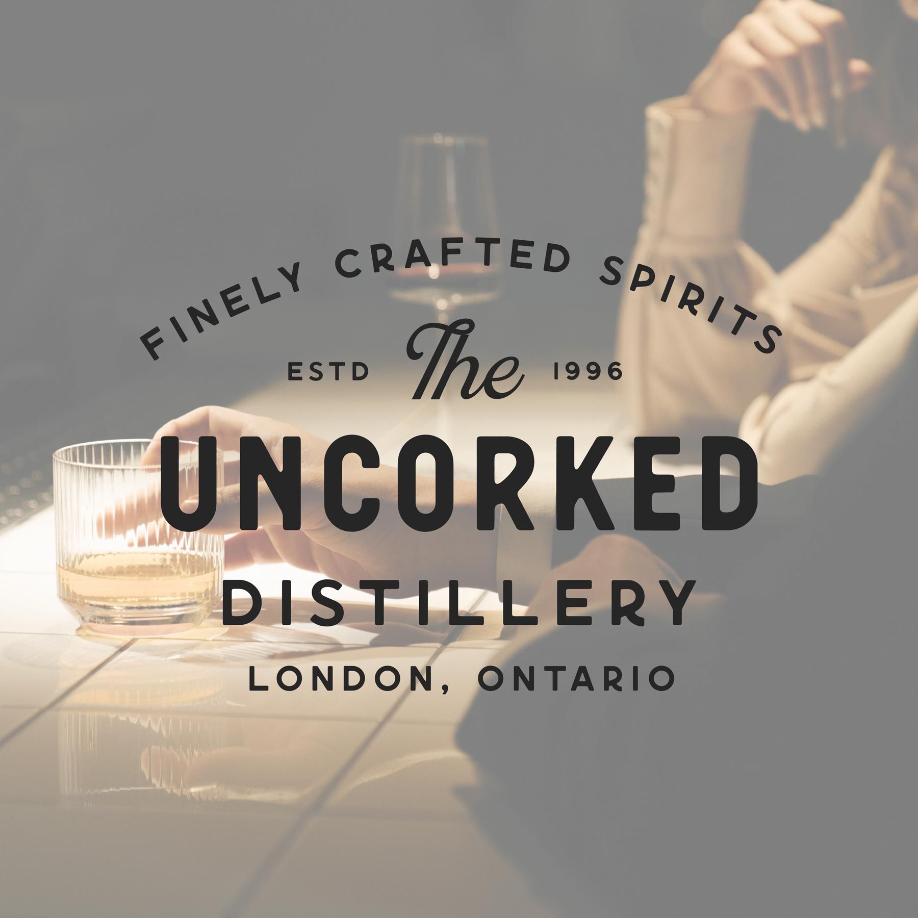 A logo for the uncorked distillery london ontario