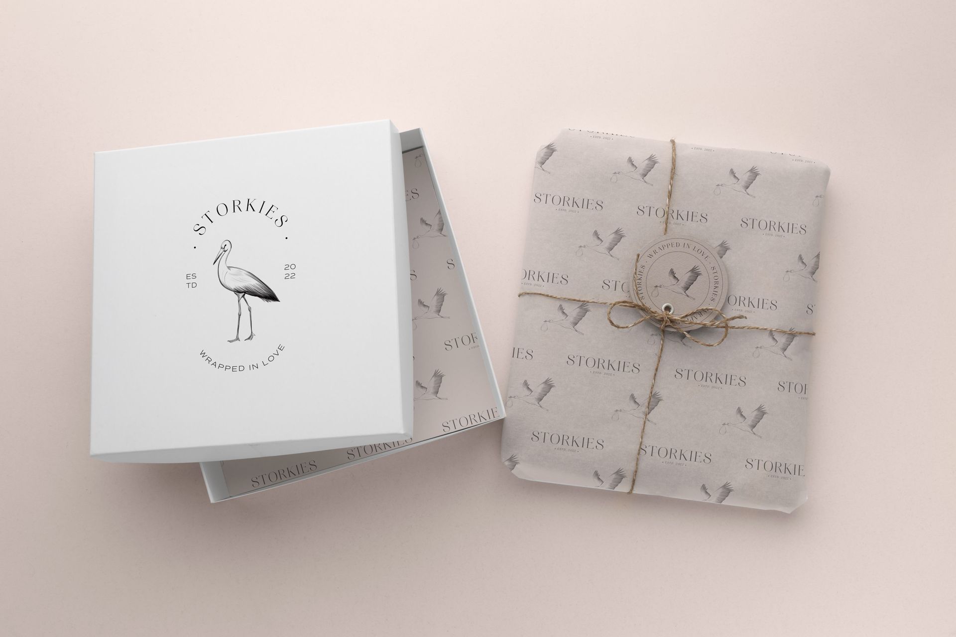 A white box and a piece of wrapping paper on a table.