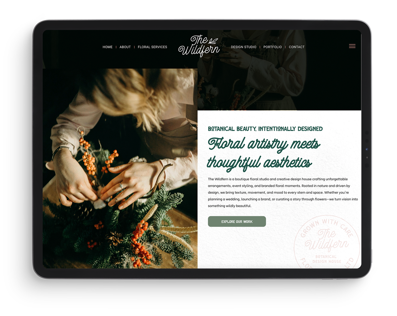 A woman is making a wreath on a tablet.