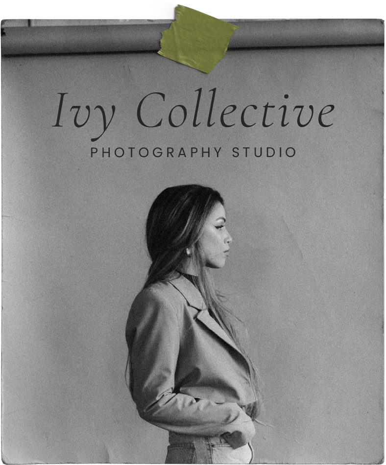 A black and white photo of a woman standing in front of a sign that says ivy collective photography studio.