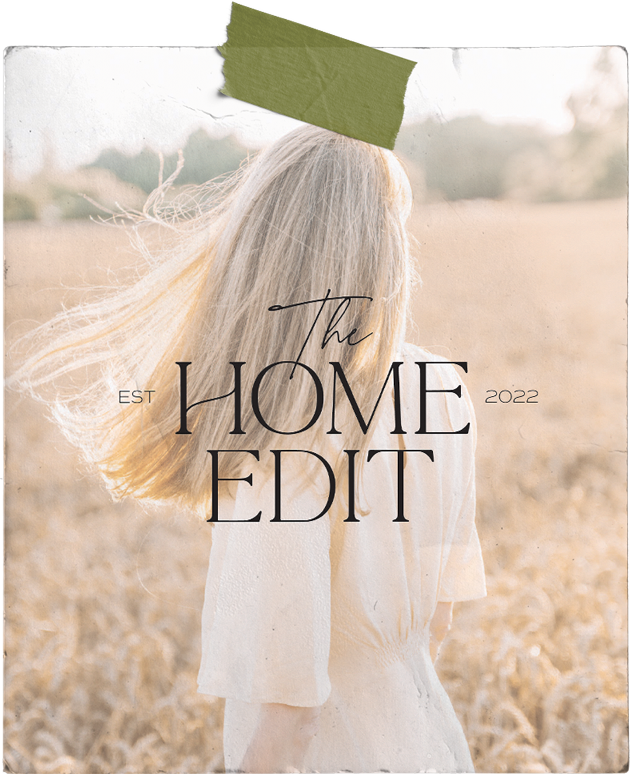 A woman in a white dress is standing in a field with her hair blowing in the wind for semi-custom brand kits