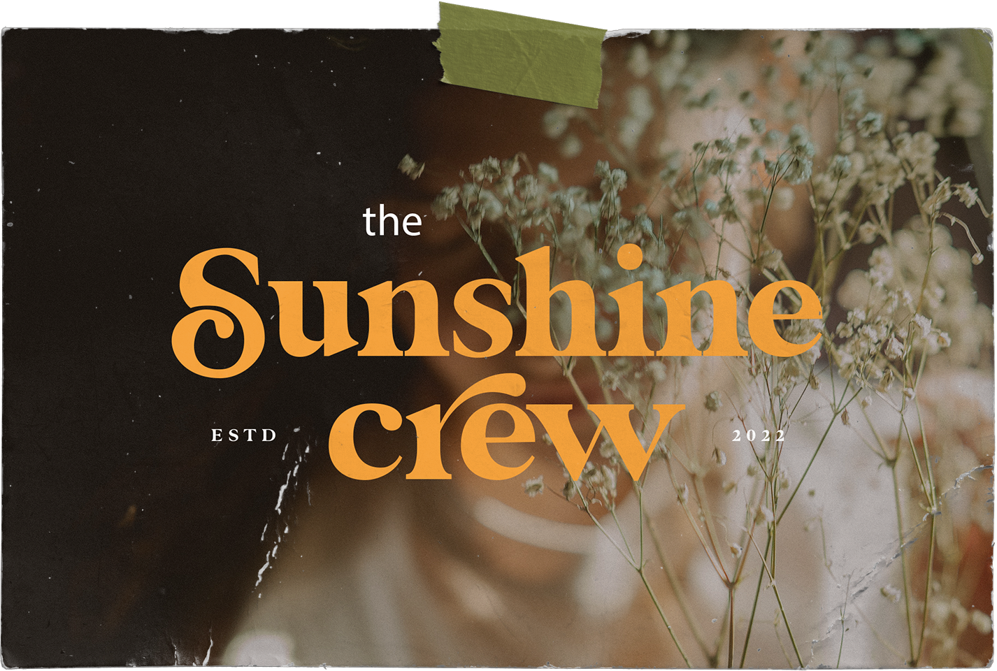 A poster with a sunshine crew logo with flowers in the background.