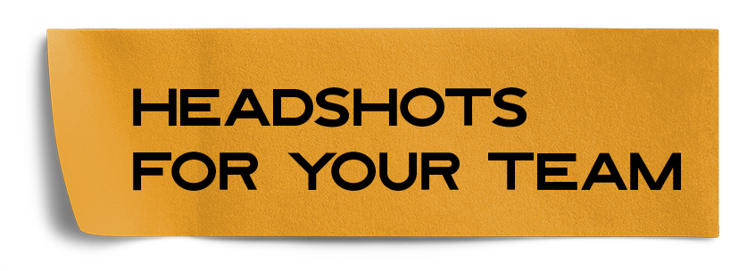 A yellow sticky note that says headshots for your team
