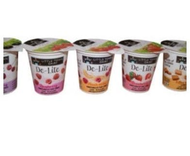 Various flavours of dairy yoghurt cups lined up in a row.