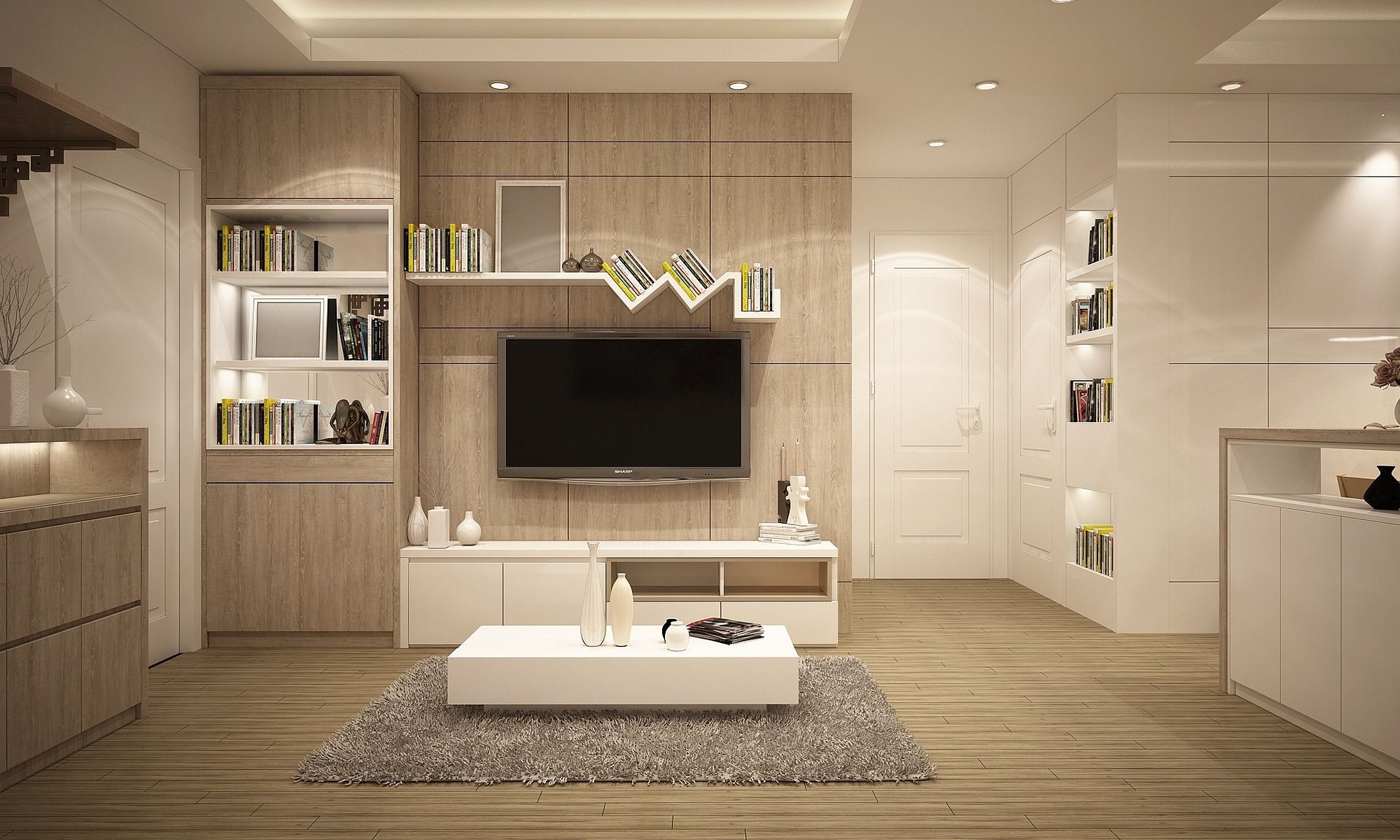 Modern beige living room with wall-mounted TV, shelves, white coffee table, and rug