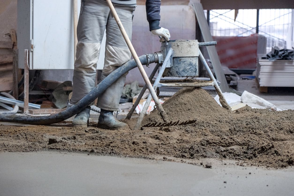 A man is using a vacuum cleaner to remove dirt from the floor.