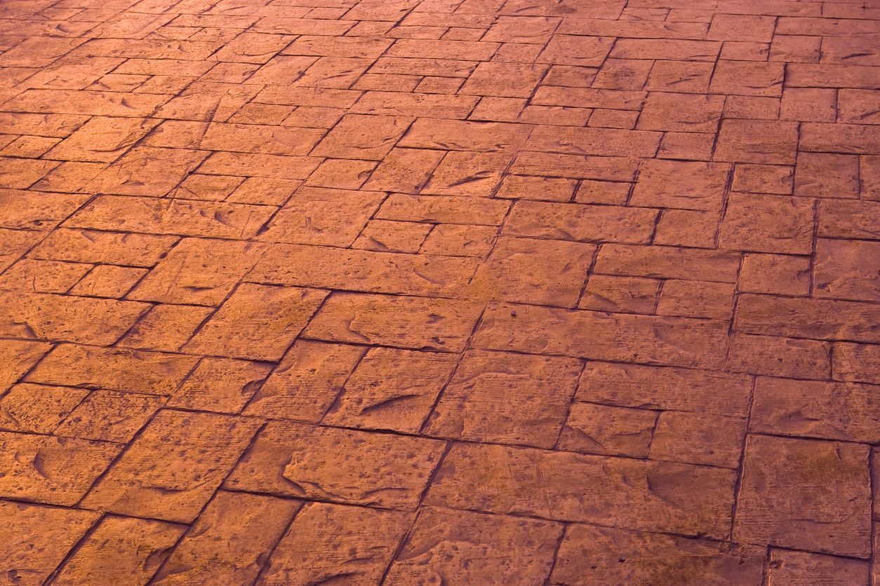A close up of a brick floor with a geometric pattern.