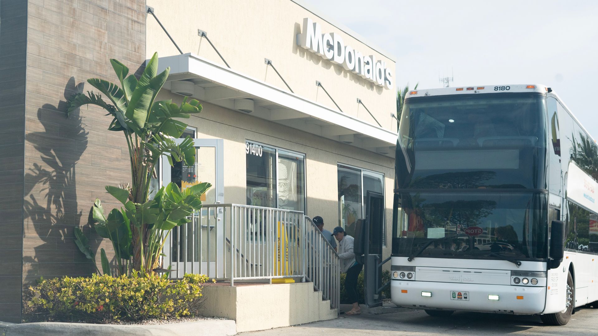 Tour passengers reboarding bus after morning stop at McDonald's in Key Largo on the way to the Florida Keys, on the Best Key West Bus tours
