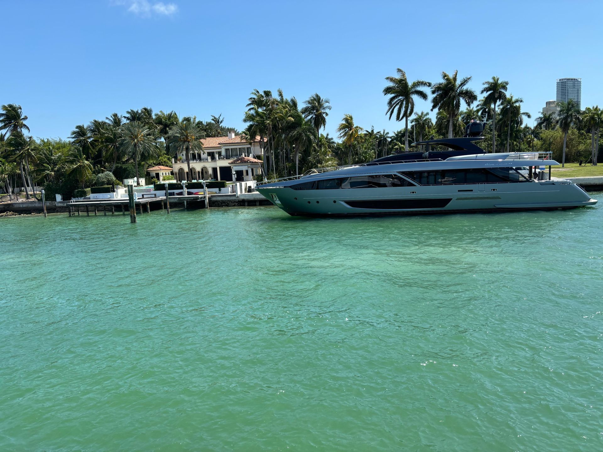 Yacht Docked in the back of Mansion in Star island Miami