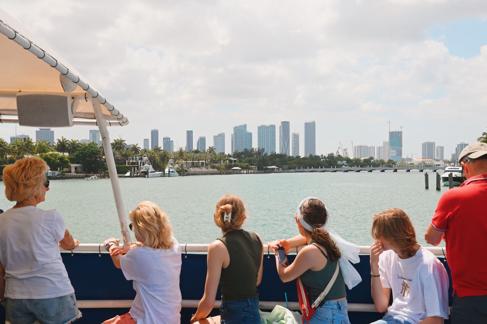 Miami Boat tours passing by with passengers by the Miami Skyline on the Miami Boat Tours