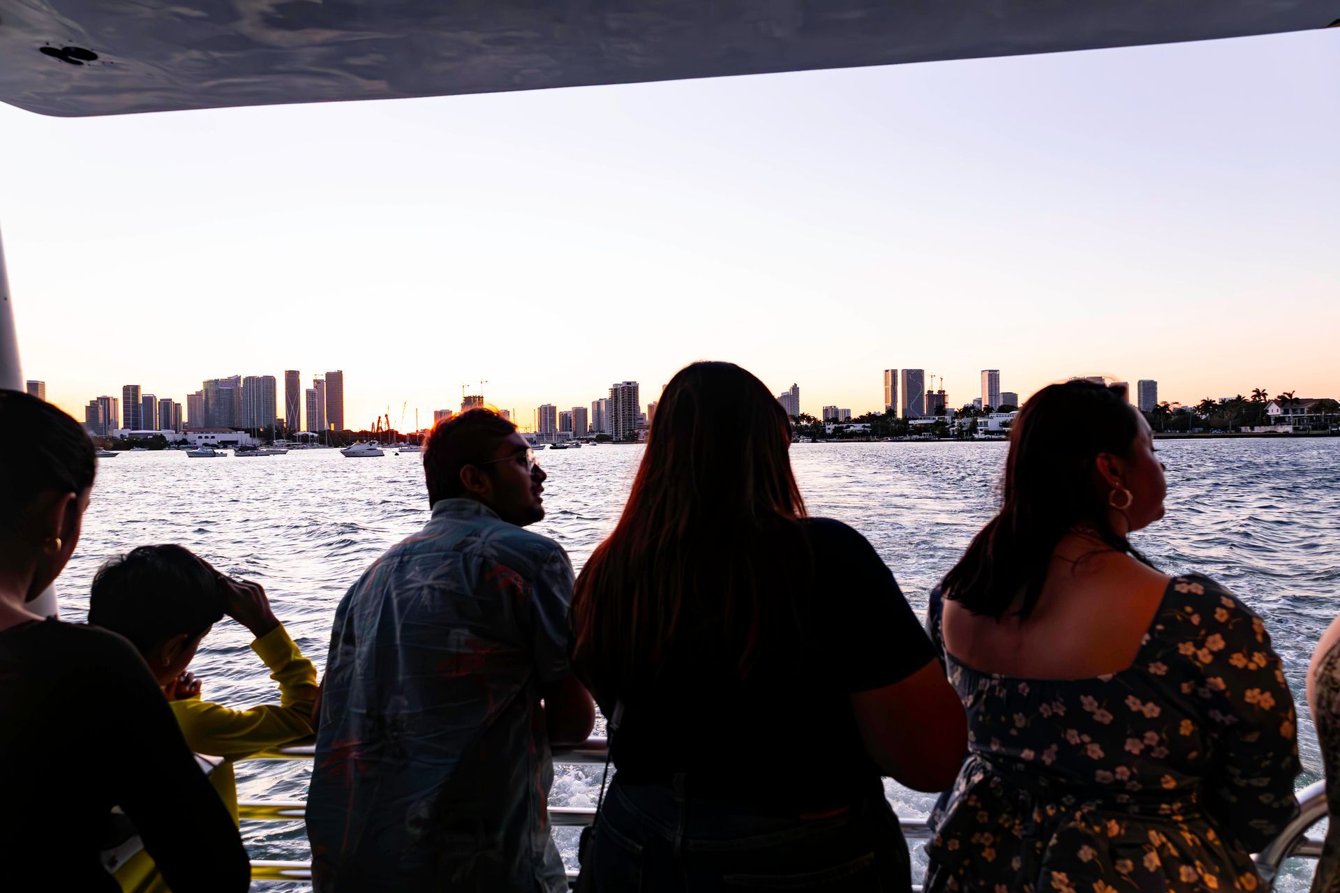 Guests enjoying sunset views of the Miami skyline during the Star Island and Skyline boat tour