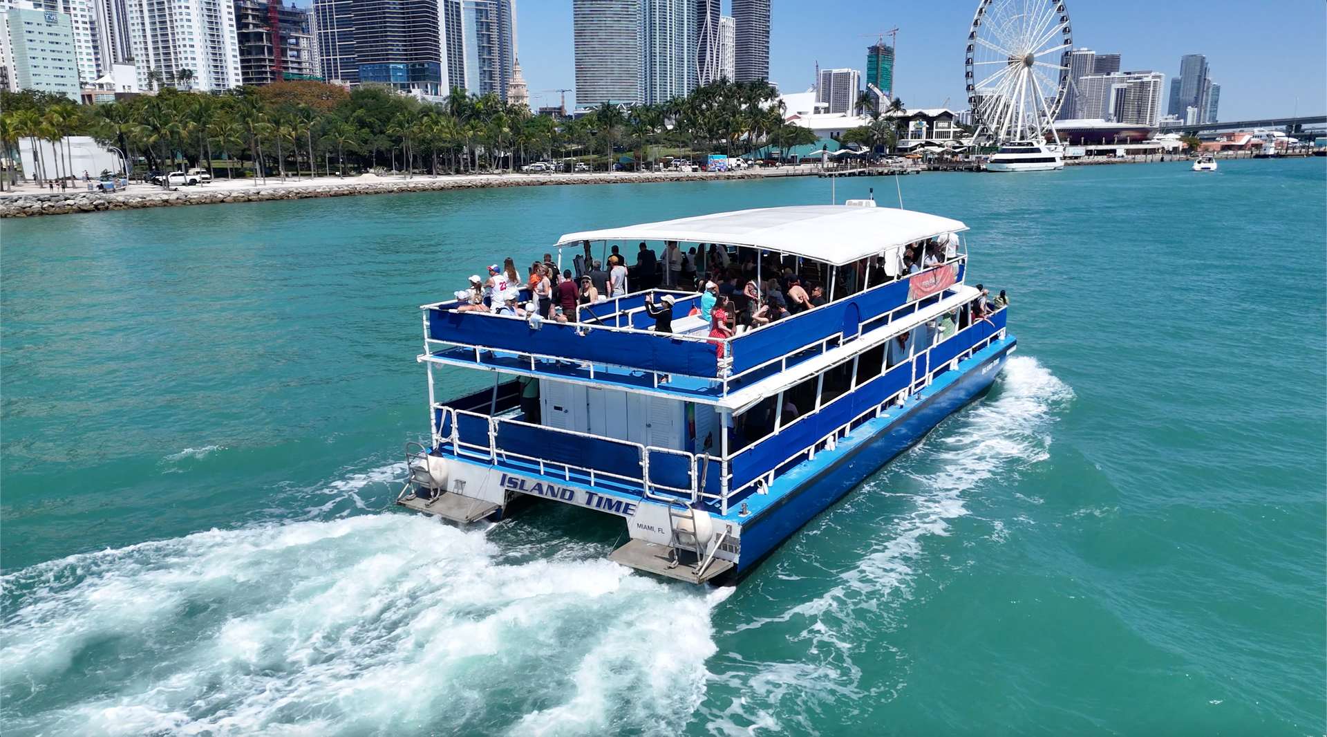Miami boat tour in Biscayne bay with the Miami Skyline on the left top Miami water tour