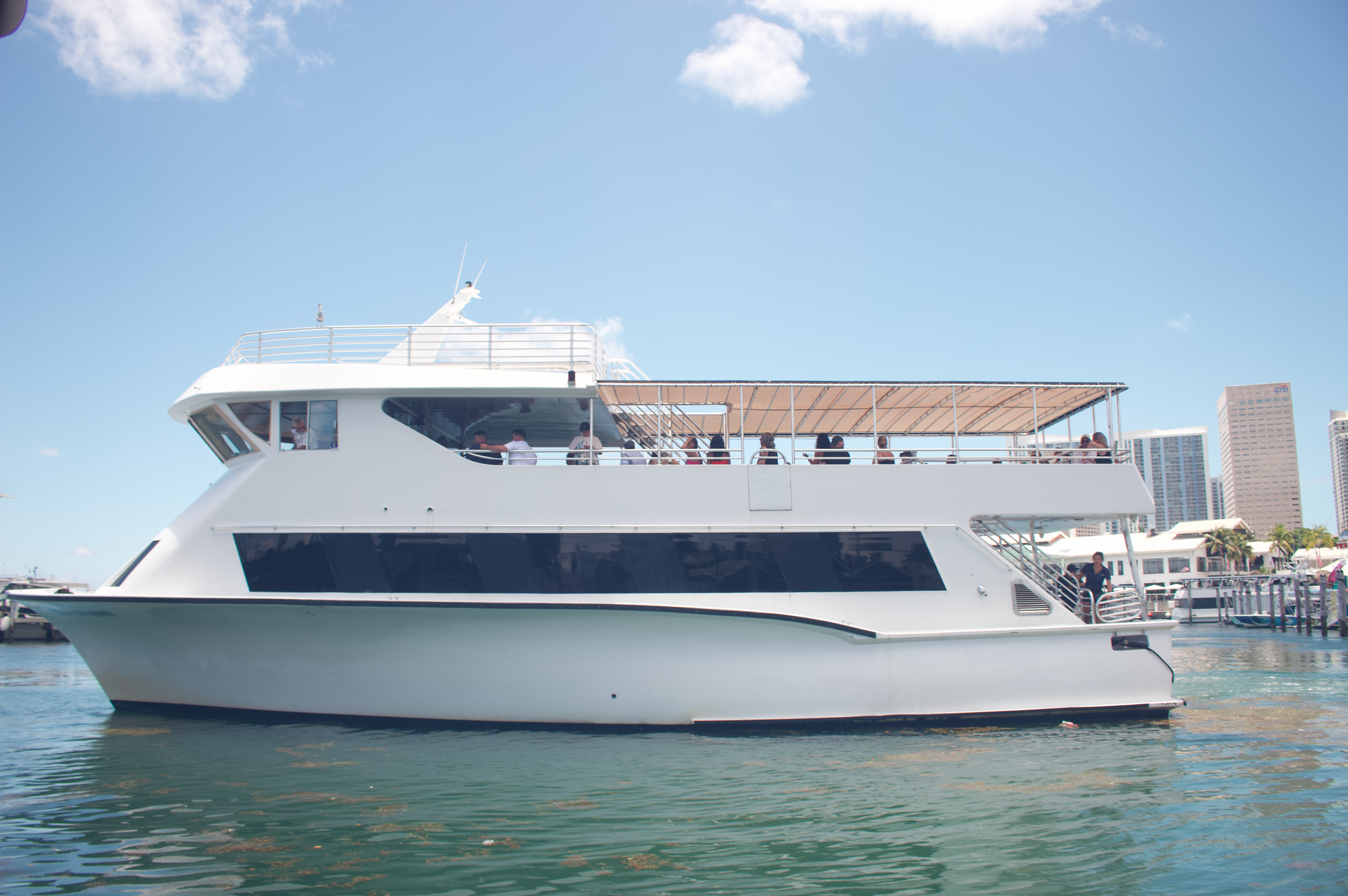 Boat Tour in Miami with Departure Times Displayed at Bayside Marina