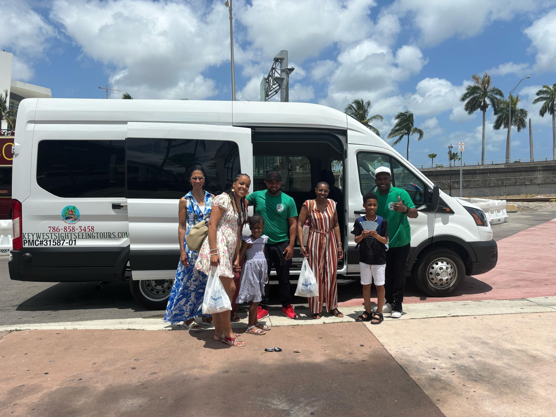Miami tour of the City with passengers taking photos with driver and tour guide in Bayside