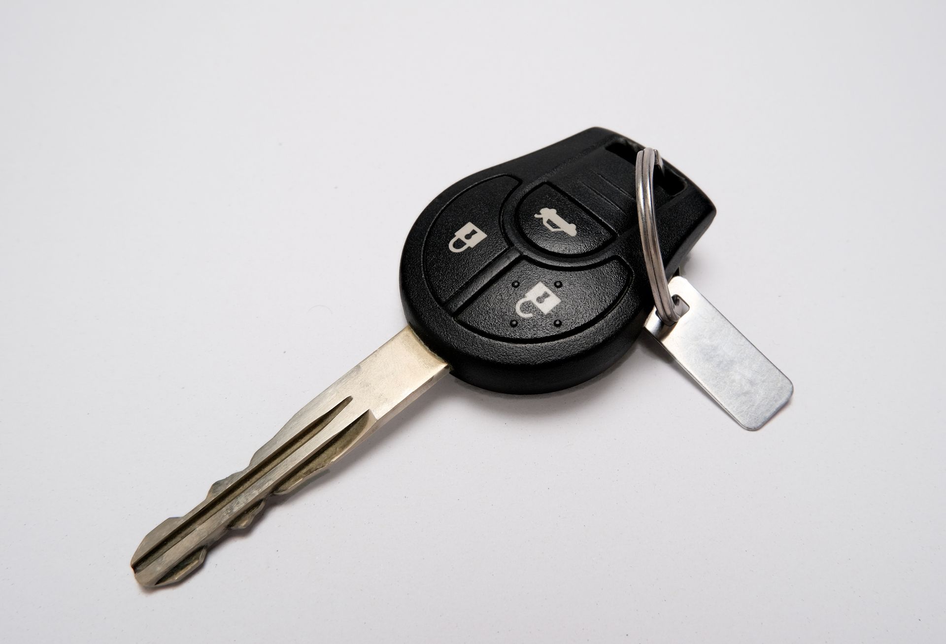 A key fob with a metallic label on a white background A key fob with a metallic label on a white background