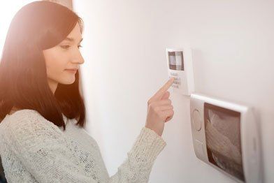 A Woman Setting Digital Door Lock — Menlo Park, CA — A-A Lock & Alarm Inc