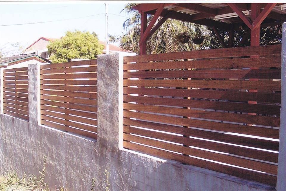 A Wooden Fence With a Pergola in the Background — Harbour Fencing In Moonee Beach, NSW