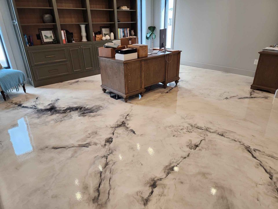 A living room with a marble floor and furniture.