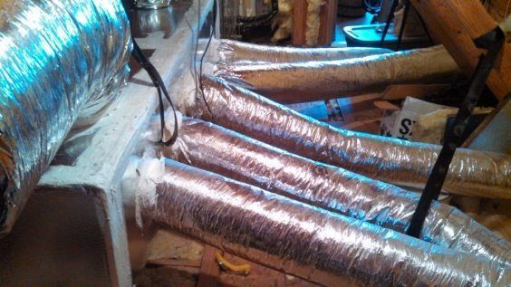 A bunch of ducts are sitting on top of each other on a table.