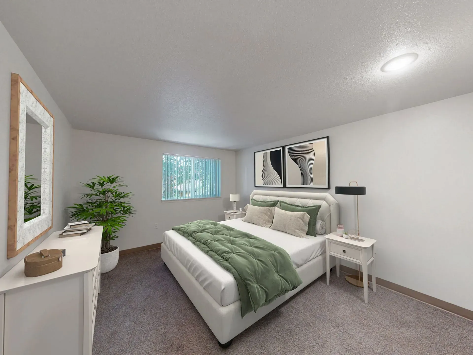Bedroom with white walls, carpet, a bed with green blanket, dresser, and a plant.