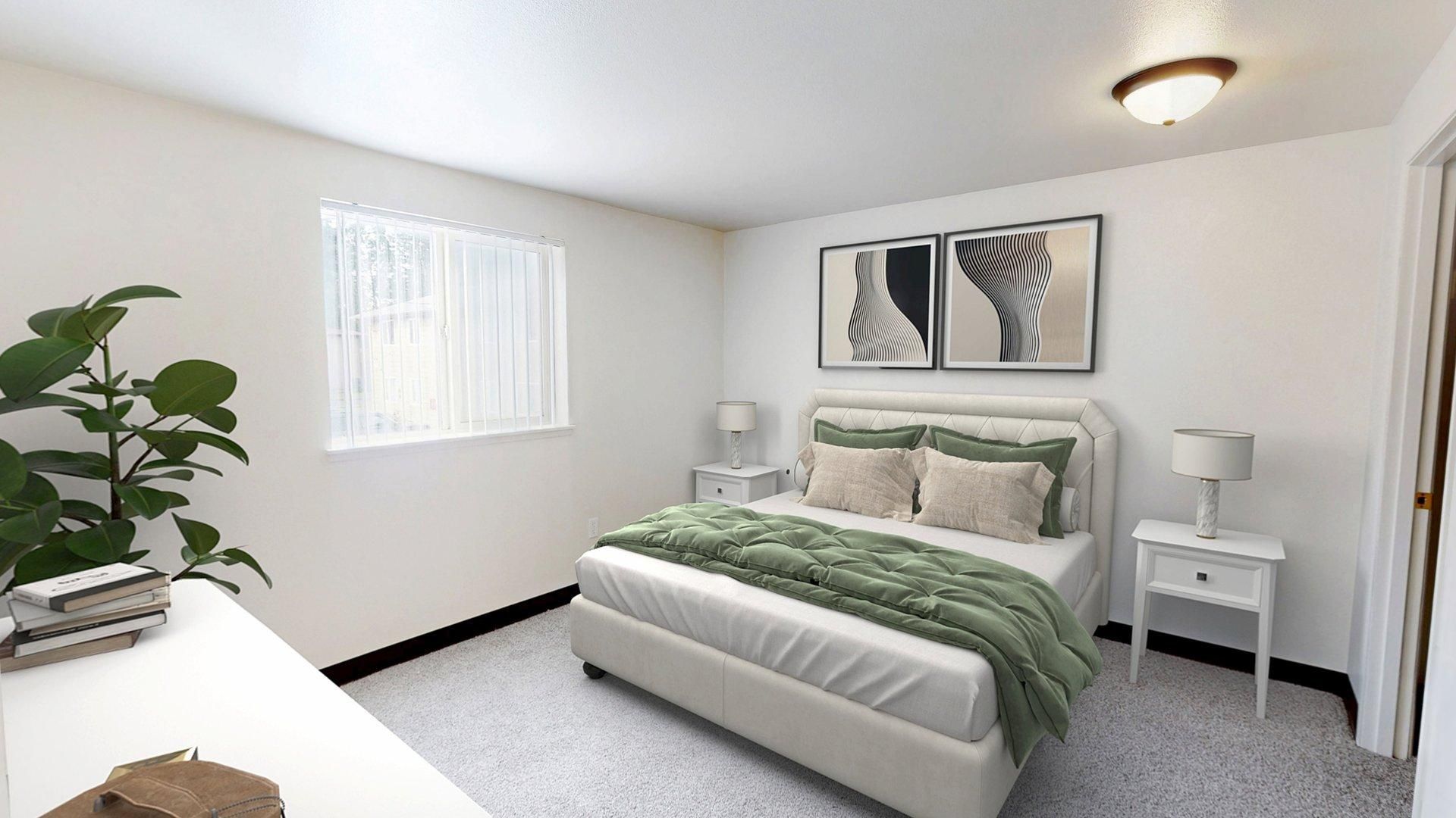 Bedroom with white walls, bed with green blanket, two nightstands, and abstract artwork.