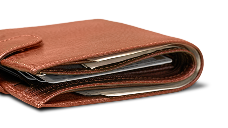 Brown leather wallet with cards partially visible inside