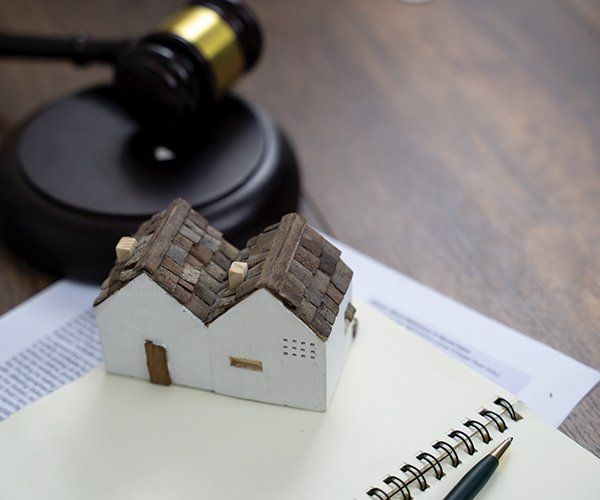 Gavel with Small House Model — Independence, MO — McElligott Ewan & Hall PC