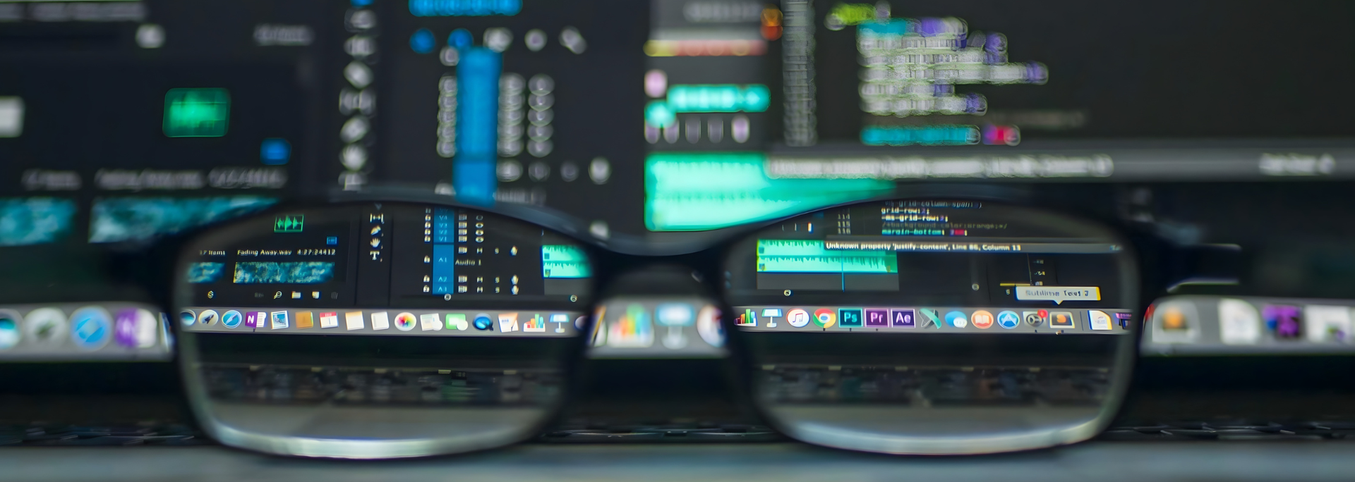 Picture of glasses on a desk.