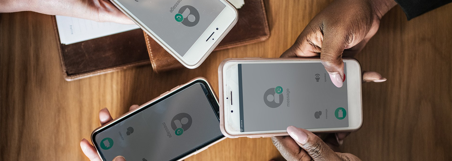 Picture of people using phones. 