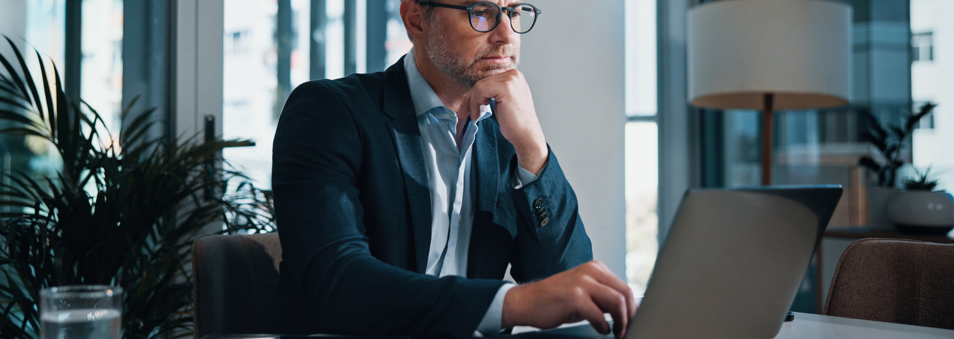 Picture of a business man on a computer. 