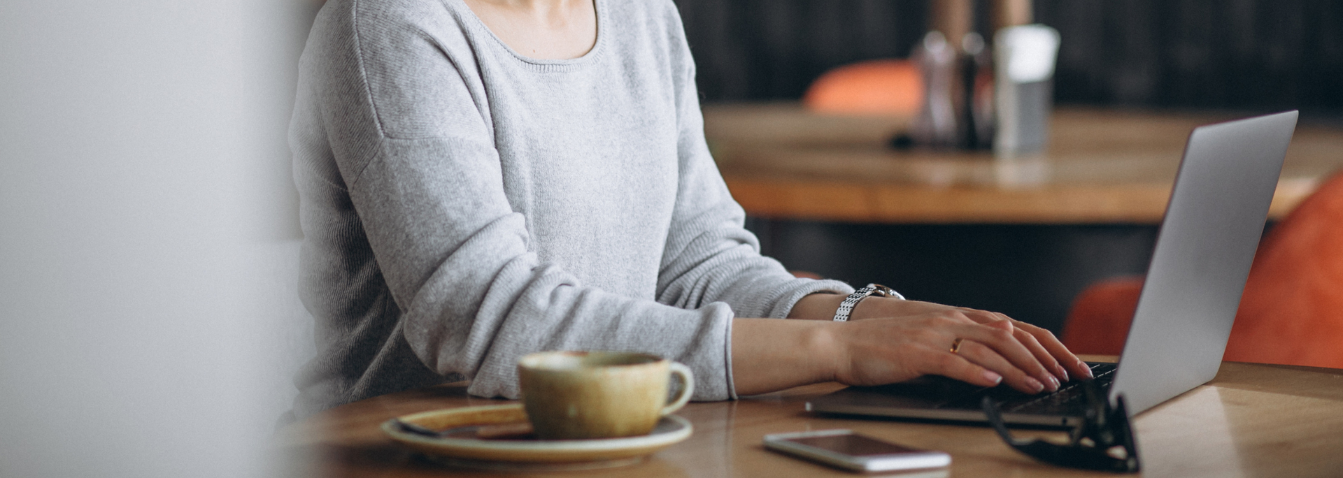 Picture of someone working outside the office. 