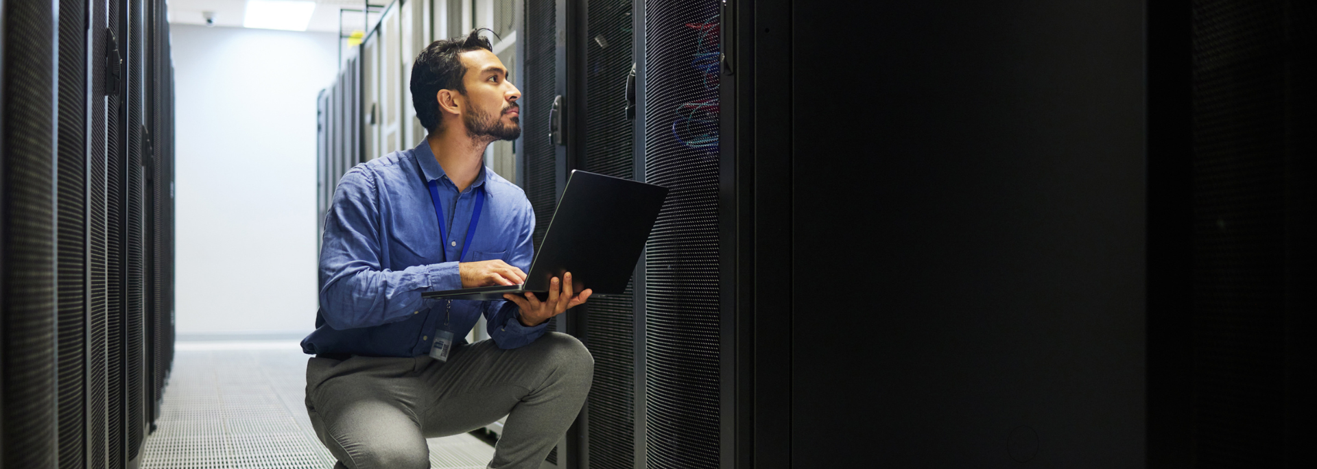 Picture of a professional in a server room. 