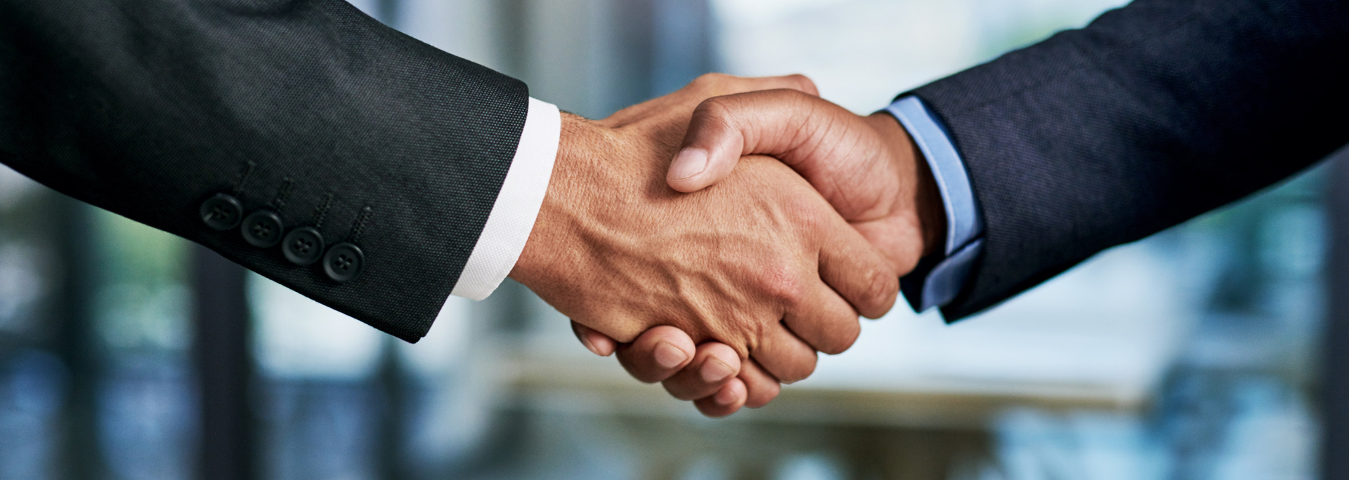 Picture of people making an agreement. 