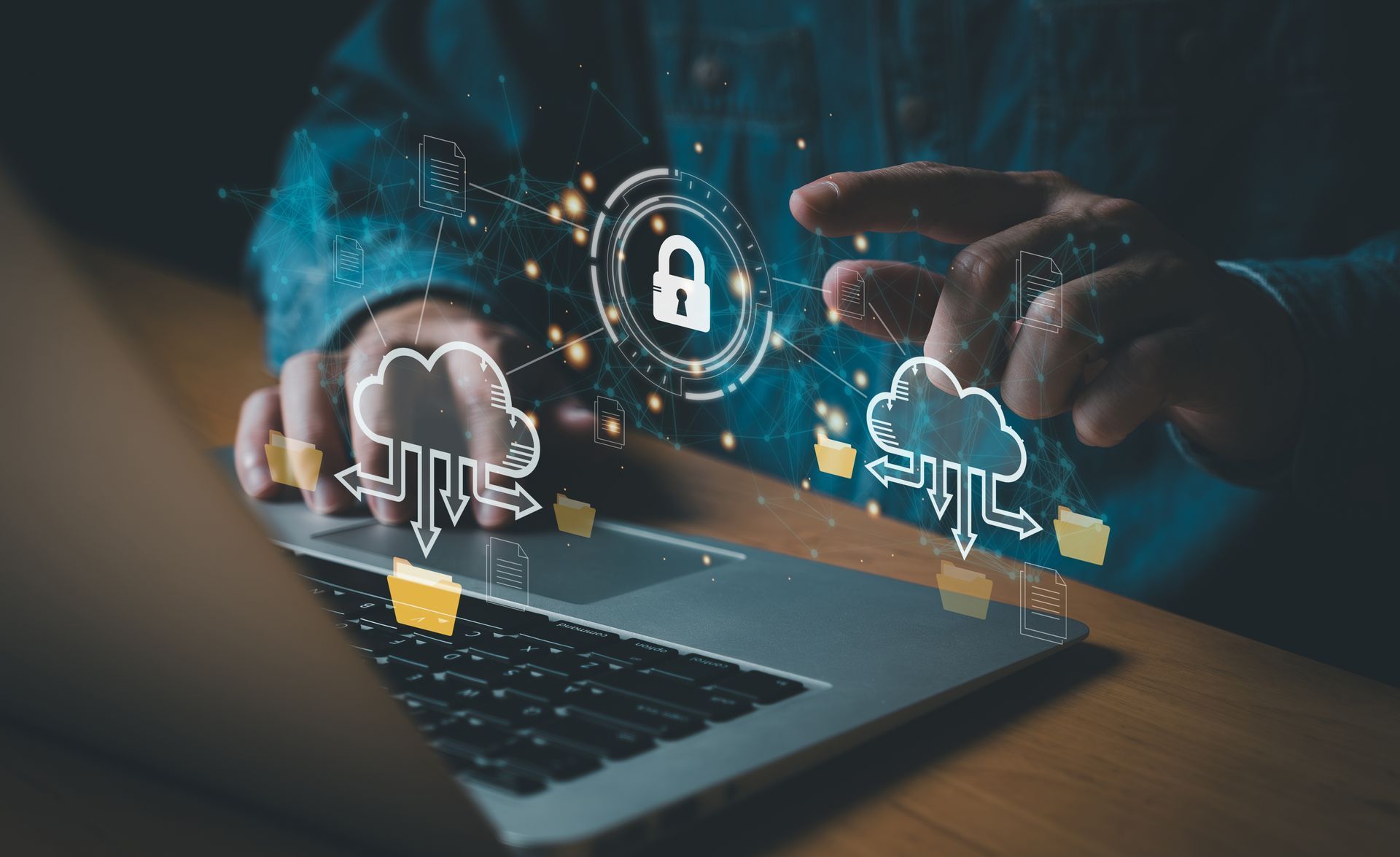 Person using laptop with cloud and lock icons, representing secure cloud storage.