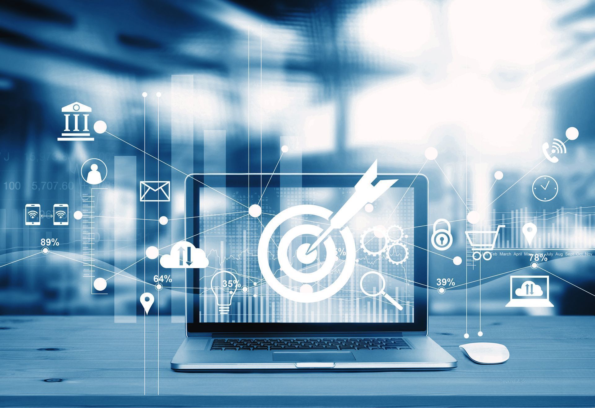 Laptop with a target graphic overlaid with digital icons and data visualizations.
