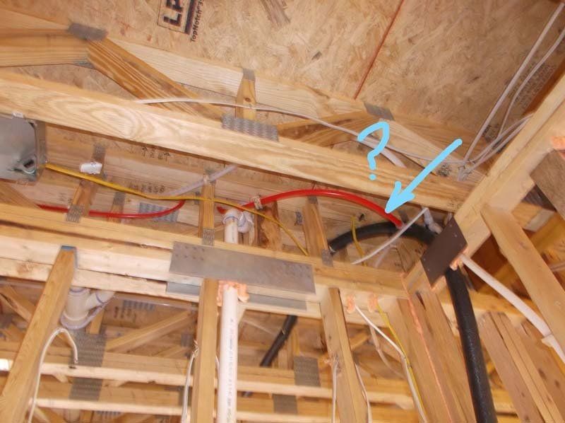 A ceiling with a blue arrow pointing to a question mark