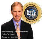 A man in a suit and tie is standing in front of a trustdale certified seal.