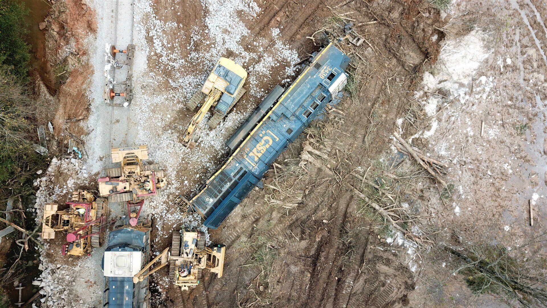 An aerial view of a train that has crashed into a hill.