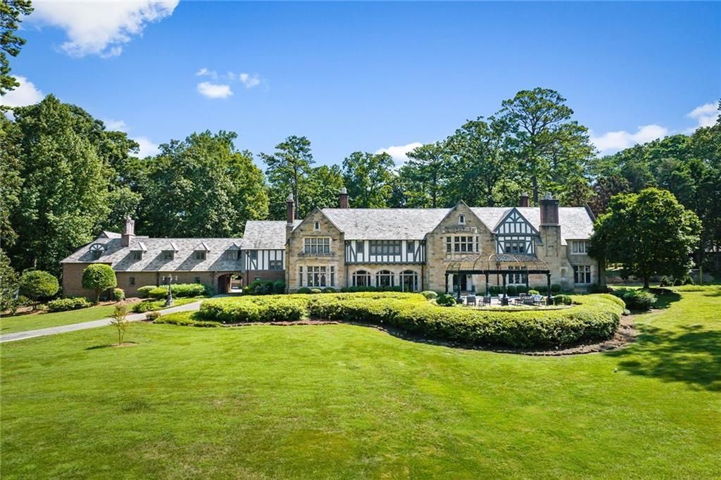 A home inspector walking through a property in Newnan, GA.