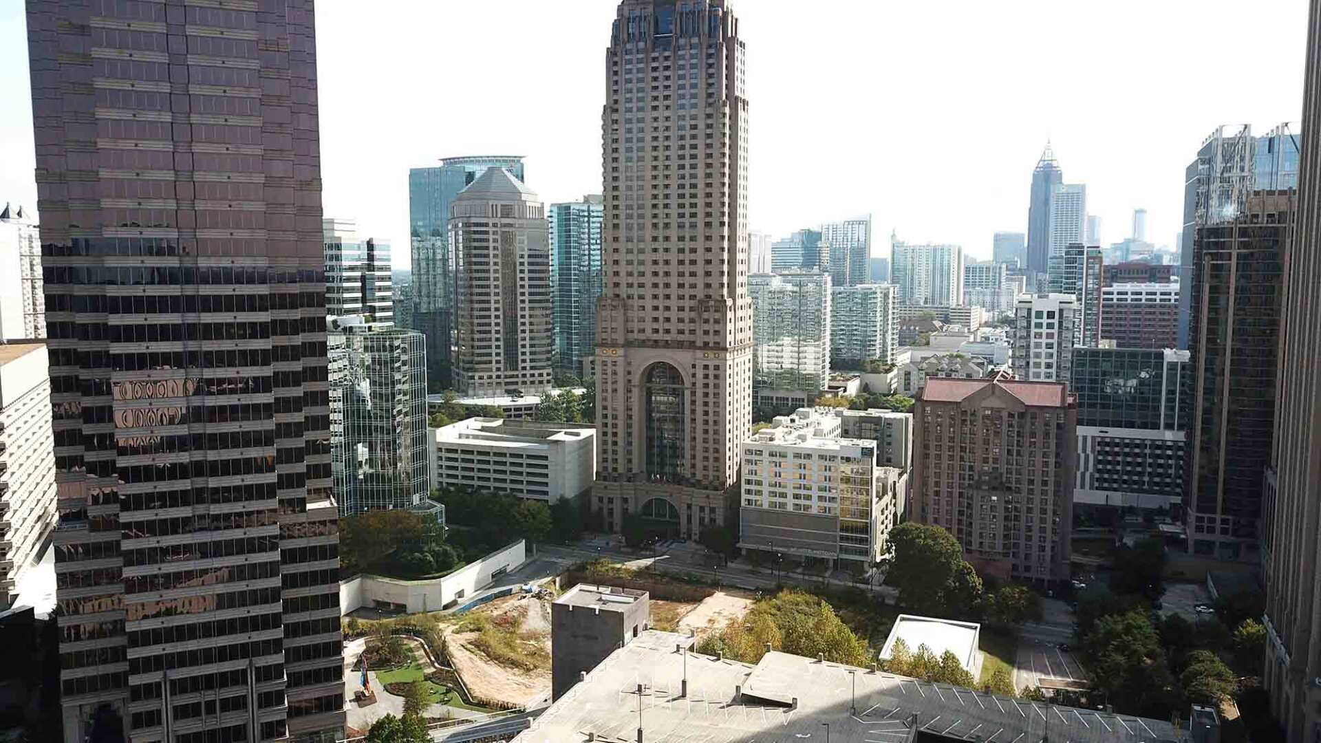 An aerial view of a city with a lot of tall buildings