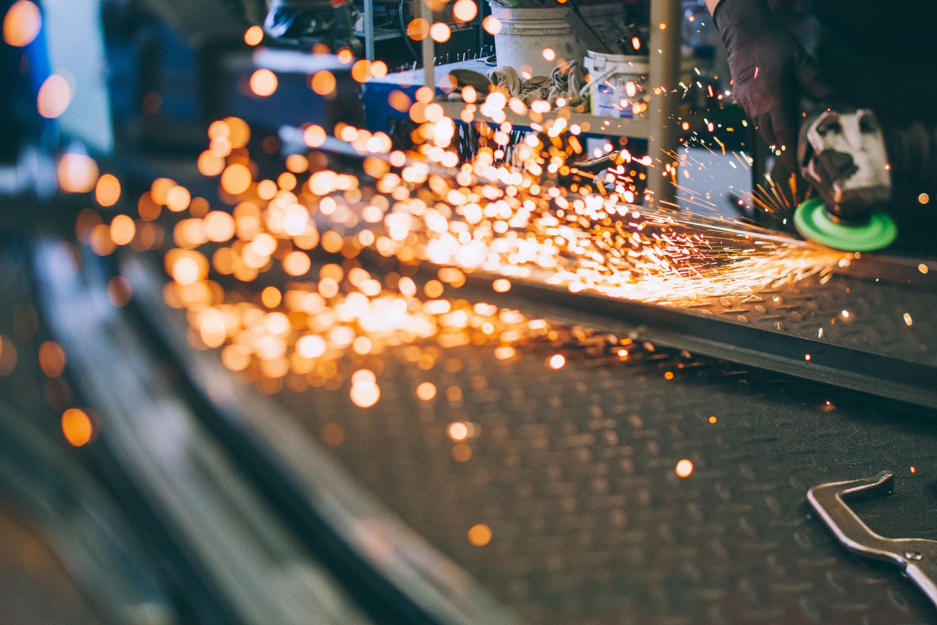 A man is working on a machine in a factory.