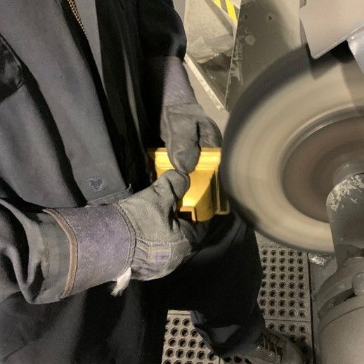 A machine is cutting a hole in a piece of metal.