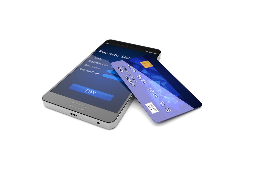 A credit card is sitting on top of a smart phone.