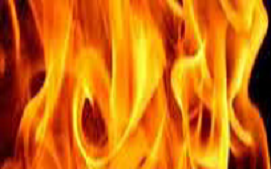 Bright, flickering flames with vivid yellow and orange hues against a dark background.