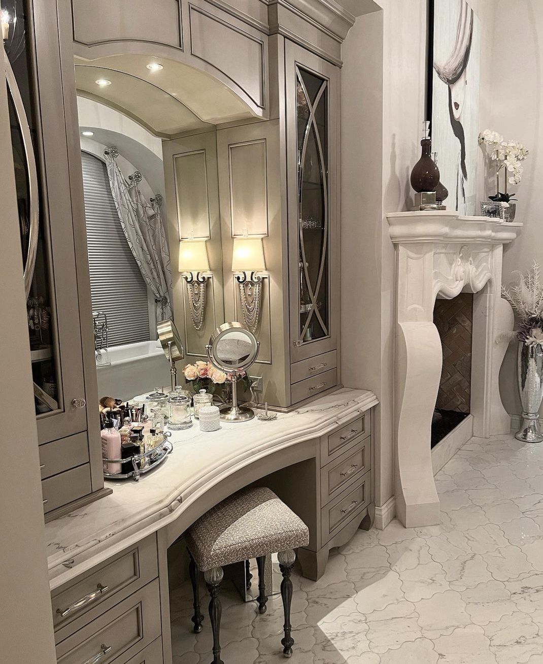 A bathroom with a dressing table and a fireplace
