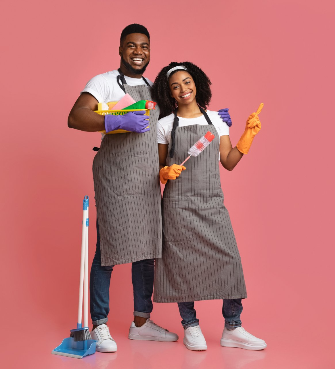 Young Woman Wearing Gloves Cleaning Refrigerator