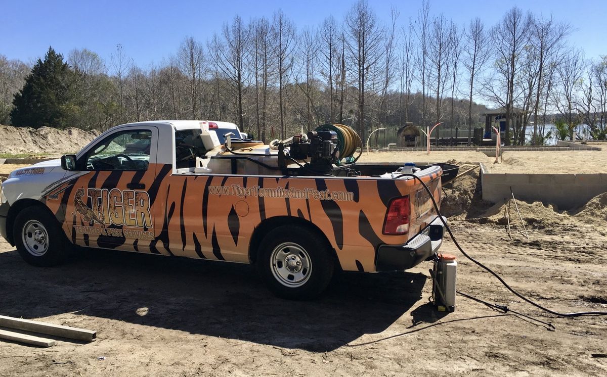 elaborately painted pest repellent truck on construction site