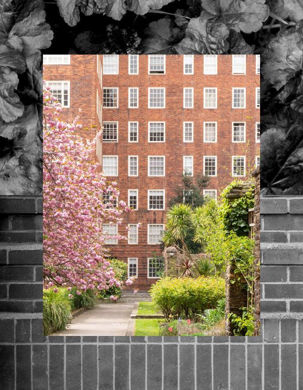 Beautiful brick building with a garden in front of it at Dolphin Square.