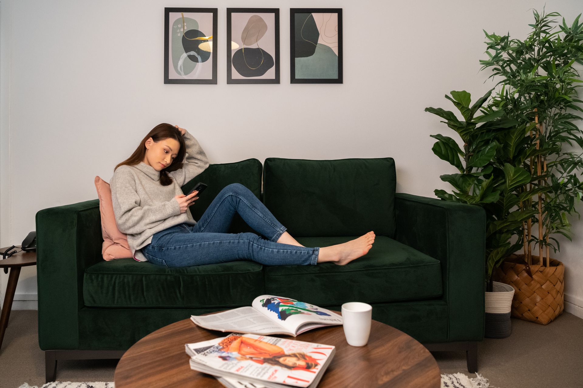 Woman lounging on couch at Dolphin Square in London, UK.